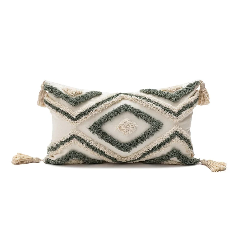 Coussin design vert avec losanges brodés
